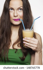 Go Juicy. Young Beautiful Woman Enjoying A Healthy Raw Fruit Vegetable Juice. Studio Shot.