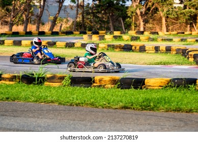 Go Kart Kids Driving Training And Racing In Provocative Style.  Selective Focus.