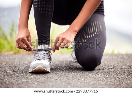 Go on girl, get it. Closeup shot of an unrecognizable woman tying her shoelaces while exercising outdoors.