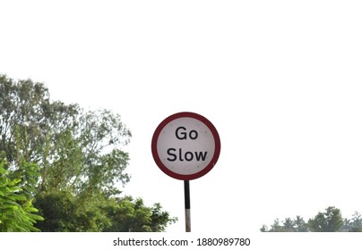 Go Slow Sign Board Beside The Highway