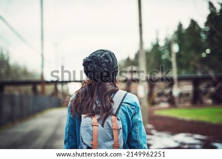 Image, Stock Photo Anonymous woman with backpack in boarding bridge