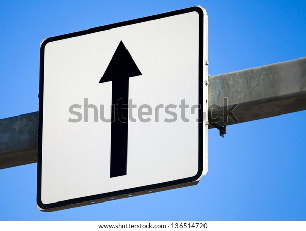 Go\
straight traffic sign with black arrow on white\
square