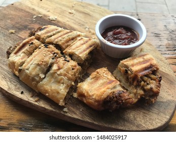 Go Vegan Delicacy Called Vegan Sausage Roll. It Is Served With Tomato Vegetable Sauce. Modern Dietary Trend With Regard To Health And Nature.