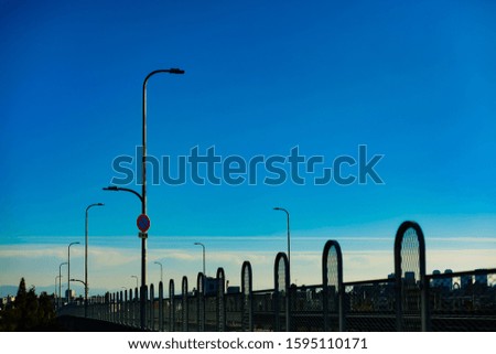 Similar – wooden platform with blue posts with ropes and orange lifebuoys on the background of the sea and sky with clouds Egypt Dahab South Sinai