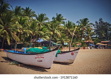 GOA, India - 02 18 2020: fishing boats on the background of the sea and palolem and patnem beach on a beautiful sunny day