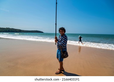 GOA, INDIA - FEBRUARY 23, 202: Unidentified tourists or people walking, running, and enjoying at Galgibaga Beach, South Goa. Galgibaga Beach is one of the best beaches in Goa