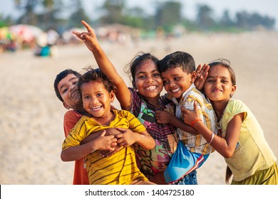 GOA, INDIA - NOVEMBER 08, 2011: Unidentified indian children playing and posing at the beach in Goa in India
