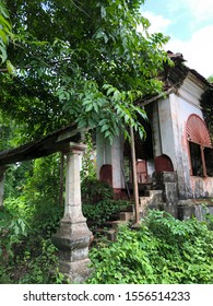 Goa, India - November 10, 2019: Nature Steadily Encroaches On A Dilapidated Portuguese-style House With Terracotta Tiles In North Goa District.