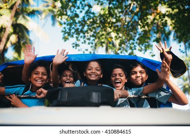 Goa, India - October 16, 2014:  Kids Are Waving Through The Bus Window On October 16, 2014 In India, Goa