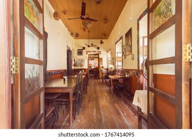 GOA, INDIA: Open Window To Cozy Dining Room Of Old Style Cafe In Indian City On March 1, 2017. Near 5 Million Tourists Visit Goa Annually