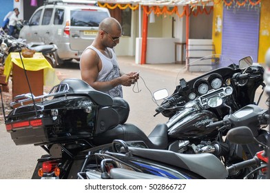 GOA,INDIA - OCTOBER 27,2011: Hiker With Motorcycle Harley Davidson In Vagator