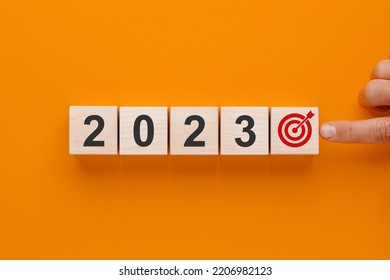 Goal 2023 new year. Wooden cubes with numbers 2023 and target icon on orange background. Business development strategy, advancement and goal concept. - Shutterstock ID 2206982123