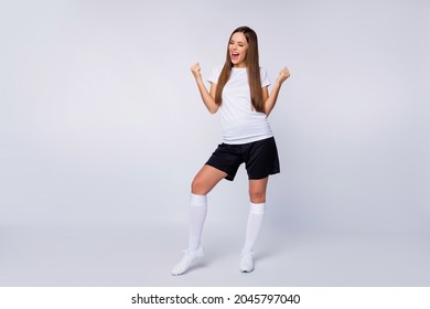 Goal Full length photo of cheerful sports fan lady raise fists supporting players wear favorite football team uniform t-shirt shorts long socks cleats isolated white color background