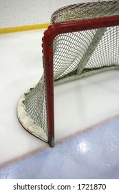 Goal Post And Net In A Hockey Arena.