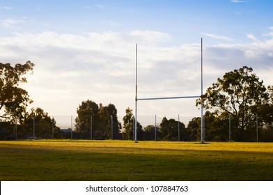 Goal Posts For Football, Rugby Union Or League On Field At Sunset