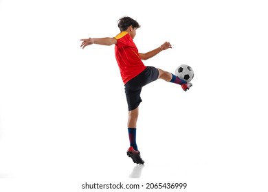 Goal. Toe Punt. Portrait Of Boy, Male Soccer Football Player Training, Kicking Ball Isolated On White Background. Concept Of Action, Team Sport Game, Energy, Vitality. Copy Space For Ad.