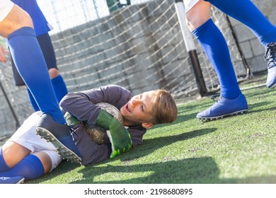 Goalkeeper Catches The Ball In The Penalty Area. Young Teen Soccer Game