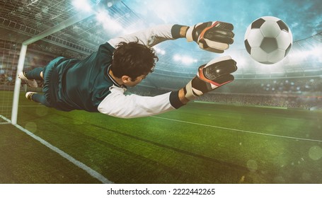 Goalkeeper catches the ball in the stadium during a football game - Powered by Shutterstock