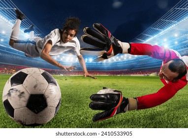 Goalkeeper catches the ball in the stadium during a football game. - Powered by Shutterstock