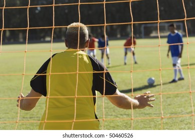 Goalkeeper Defending, Back View