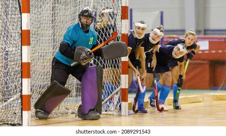 Goalkeeper and her teammates defence the net from the corner shot in indoor hockey game. - Powered by Shutterstock