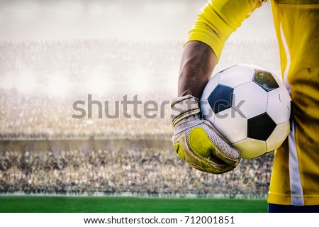 goalkeeper with a soccer ball in the stadium