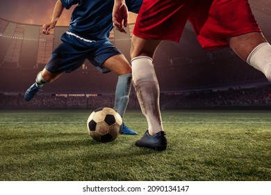 Goalmouth scramble. Two male soccer, football players dribbling ball at the stadium during sport match at crowed stadium. Sport competition. Action, motion, fitness, energy and dynamic concept. - Shutterstock ID 2090134147