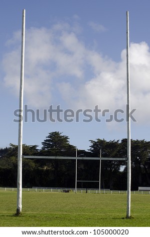 Goalposts in empty football rugby goal field. The game is very popular in commonwealth countries. No people. Copy space