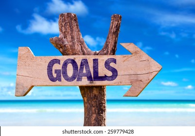 Goals wooden sign with beach background 