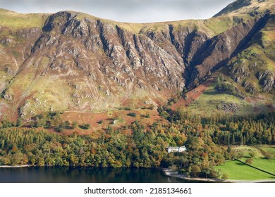 Goat Crag and Dalesgarth on the waters edge near Buttermere in the Autumn from below High Stile in the Lake District, UK. - Shutterstock ID 2185134661