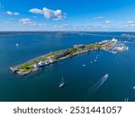 Goat Island aerial view including Goat Island Marina and Newport Harbor Island Resort with Claiborne Pell Newport Bridge at the back in Narragansett Bay, Newport, Rhode Island RI, USA. 