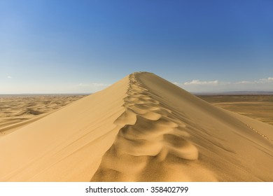 Gobi Desert Singing Sand Dunes With Blue Skies