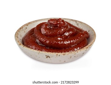 Gochujang or Korean red chili paste in a ceramic bowl isolated on white background with a clipping path. red chili sauce gochujang condiment                                                  - Powered by Shutterstock