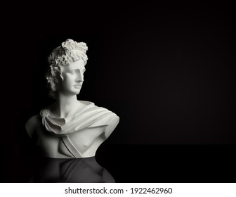 God Apollo Bust Sculpture. Ancient Greek God Of Sun And Poetry Statue Isolated On Black.