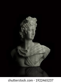 God Apollo bust sculpture. Ancient Greek god of Sun and Poetry statue isolated on black.