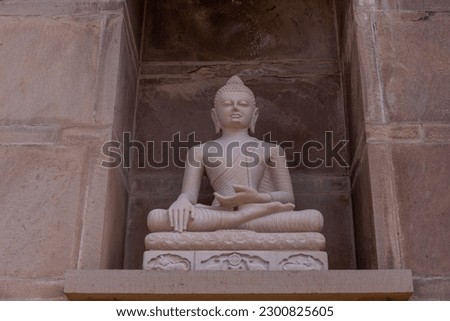 God buddha buddhishm arts. Statue of lord buddha made with indian stone.