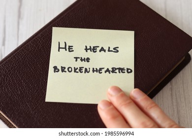 God Jesus Christ Our Healer And Deliverer Loves Us And Heals Our Wounds, Forgives Our Sins. Bible Promise Verse From Psalms Book Old Testament. The Handwritten Message Of Hope And Truth.