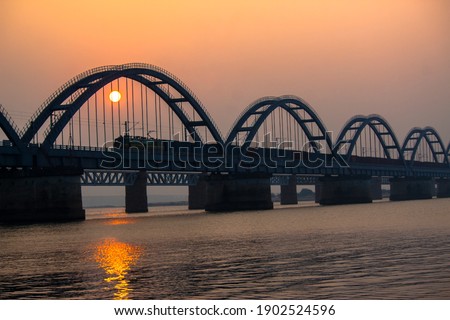 The Godavari Arch Bridge is a bowstring-girder bridge that spans the Godavari River in Rajahmundry, India. It is the latest of the three bridges that span the Godavari river at Rajahmundry.