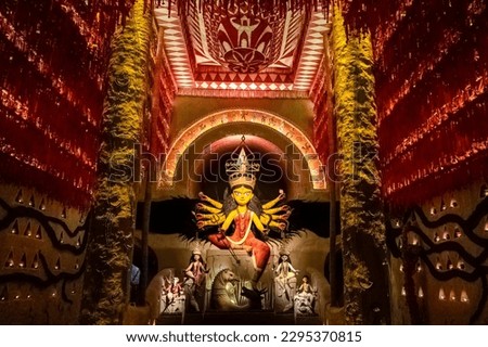 Goddess Durga devi idol decorated at puja pandal in Kolkata, West Bengal, India. Durga Puja is the biggest religious festival of Hinduism and is now celebrated worldwide. 