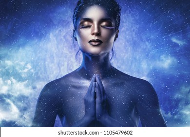 Goddess of the universe. Beautiful model in creative image of fantasy character.