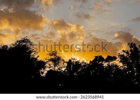 Godrays through clouds at sunset