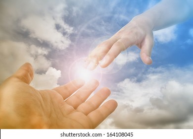God's Saving Hand. Concept of lord, reaching, heaven, religious faith. Also rescue, love, friendship, support, partnership, reaching and pandemic, coronavirus, covid-19