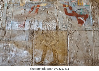 Gods Thoth and Horus making libation over the head of queen Hatshepsut, whose immage has been erased by her son Tuthmosis III, Luxor, Egypt