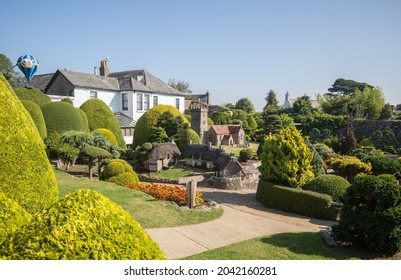 Godshill, Isle Of Wight, 2021.  Replica Of A Landscaped View Of Godshill Church With A Wedding Party.  The Model Village Was Established In 1952 And Is A Popular Tourist Attraction.