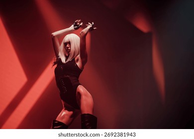 Go-go dancer under dramatic red club lights—elegance and expressive stage performance in a high-energy pose. Nightlife entertainment for EDM events, fashion campaigns, and club promotions.