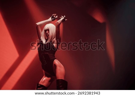 Go-go dancer under dramatic red club lights—elegance and expressive stage performance in a high-energy pose. Nightlife entertainment for EDM events, fashion campaigns, and club promotions.