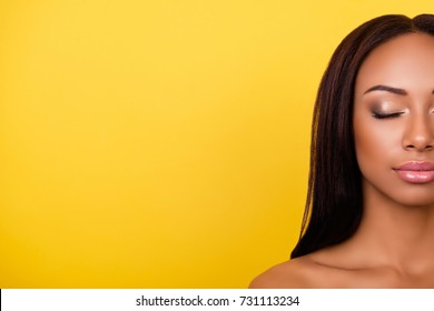 Gogreous, charming, pretty, hot nude half face cropped portrait of afro brunette lady with  attractive healthy smooth skin, shiny, clean and pure. Women beauty and make up, pampering concept