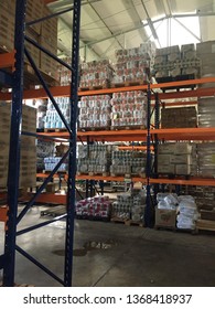 Goiania, Brazil, April 17, 2019: Internal Structure Of A Warehouse, Supermarket, With Black Steel Shelves, And Shelves Of Orange, On The Floor, Wooden Pallets