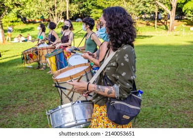 GOIANIA GOIAS BRAZIL - MARCH 01 2022: Detail of a group of women percussionists. Photo taken during the Carnival performance in a public park in the city of Goiânia.
