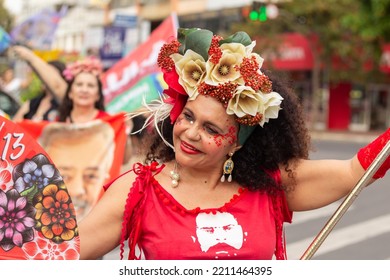 GOIANIA GOIAS BRAZIL - SEPTEMBER 28 2022: A Woman In Red Clothes Dancing In The Street. Photo Taken During A Performance In Favor Of The Presidential Candidate Of Brazil, Lula.